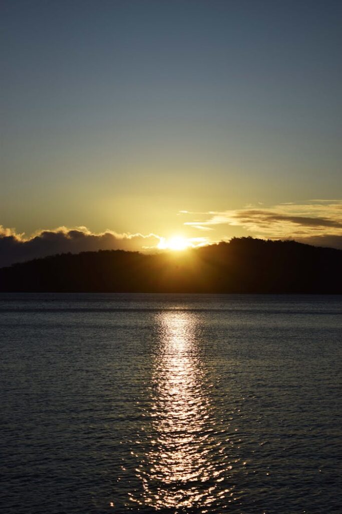 Morning Seascape with Sun Rising over a Mountain